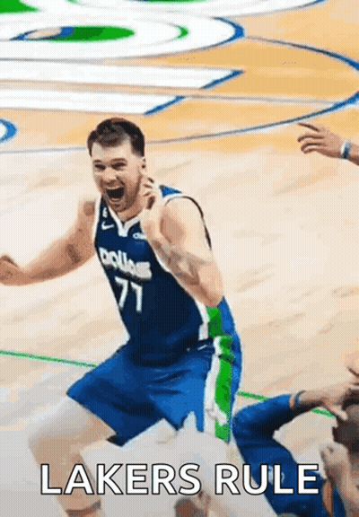 A Basketball Player Is Celebrating On The Court With The Words Lakers Rule Written On The Bottom . GIF