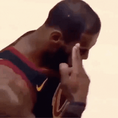 A Basketball Player Is Covering His Face With His Hand While Giving The Middle Finger . GIF