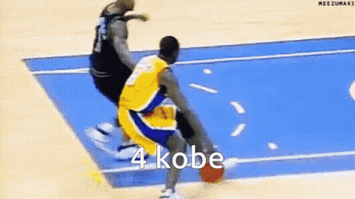A Basketball Player Is Dribbling A Basketball On A Blue Court While Another Player Tries To Stop Him . GIF