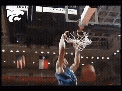 A Basketball Player Is Dunking A Basketball In Front Of A Scoreboard That Says Unite GIF