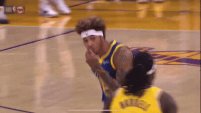 A Basketball Player Is Giving A Middle Finger To Another Player On A Court . GIF
