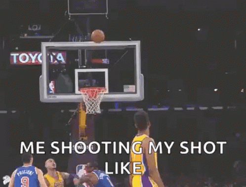 A Basketball Player Is Holding A Basketball In Front Of A Basketball Net . GIF