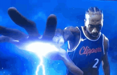 A Basketball Player Is Holding A Lightning Bolt In His Hand While Wearing A Clippers Jersey . GIF