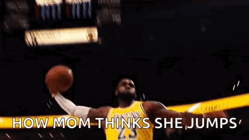 A Basketball Player Is Jumping In The Air While Holding A Basketball . GIF