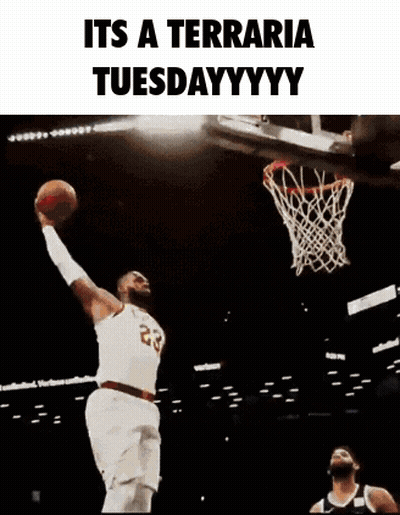 A Basketball Player Is Jumping In The Air With A Basketball In His Hand . GIF