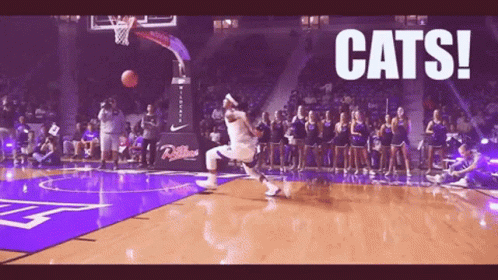A Basketball Player Is Jumping In The Air With The Words Cats Behind Him GIF