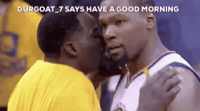 A Basketball Player Is Kissing Another Player On The Cheek GIF
