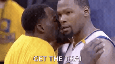 A Basketball Player Is Kissing Another Player On The Cheek While Another Player Says `` Get The Thai '' . GIF