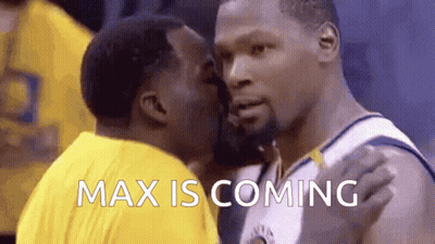 A Basketball Player Is Kissing Another Player On The Cheek While The Words Max Is Coming Are Displayed . GIF