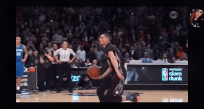 A Basketball Player Is Kneeling On The Court In Front Of A Verizon Sign GIF