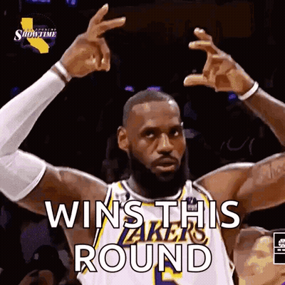 A Basketball Player Is Making A Victory Sign With His Hands . GIF