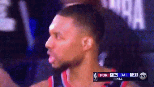 A Basketball Player Is On A Television Screen With A Scoreboard That Says Por 13 Dal 131 GIF