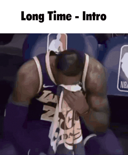 A Basketball Player Is Sitting In The Stands With His Head In His Hands And The Caption Long Time Intro GIF