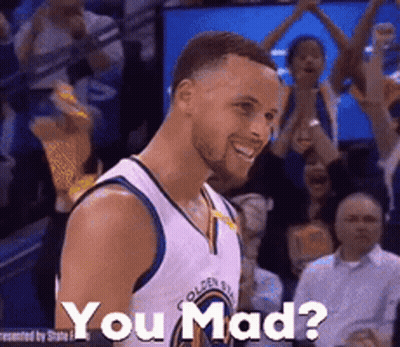 A Basketball Player Is Smiling In Front Of A Crowd And Says " You Mad " . GIF