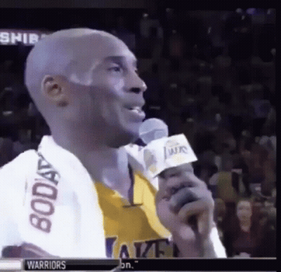 A Basketball Player Is Speaking Into A Microphone While Wearing A Warriors Jersey . GIF