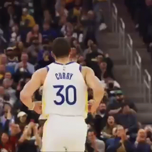 A Basketball Player Is Standing In Front Of A Crowd Wearing A Number 30 Jersey . GIF