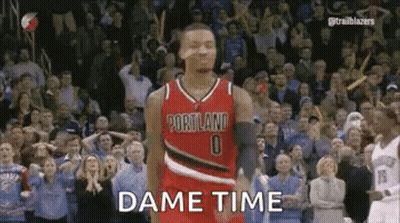 A Basketball Player Is Standing In Front Of A Crowd While Wearing A Portland Jersey . GIF