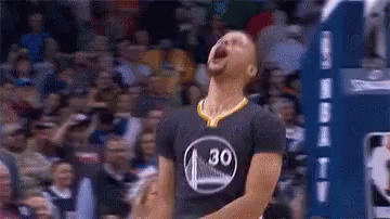 A Basketball Player Is Standing On A Court With His Mouth Open And A Crowd Behind Him . GIF