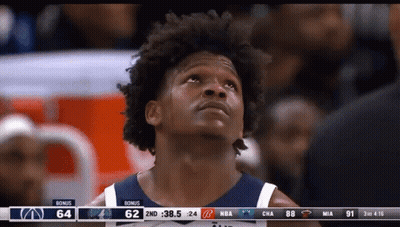 A Basketball Player Looking Up At The Scoreboard GIF
