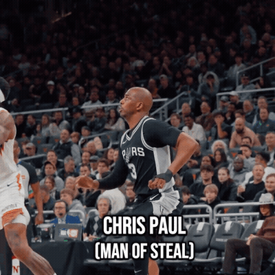 A Basketball Player Named Chris Paul Is Running On The Court In Front Of A Crowd GIF