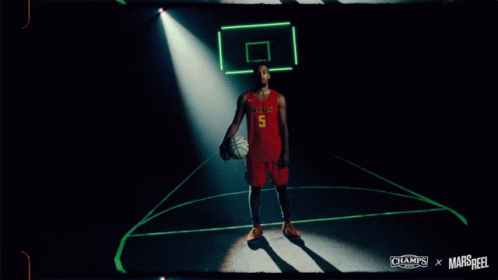 A Basketball Player Named Justyn Hunter Holds A Basketball GIF
