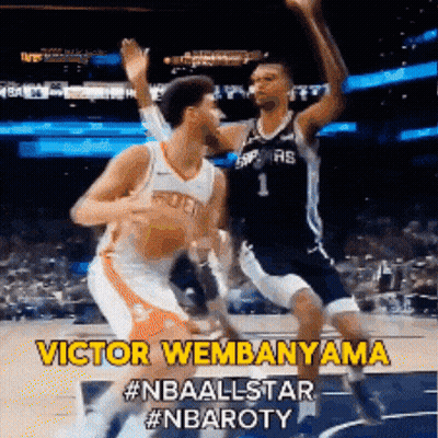A Basketball Player Named Victor Wembenama Is Jumping In The Air GIF