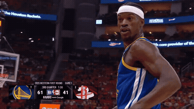 A Basketball Player Pointing At The Scoreboard Which Says 7:30 On It GIF