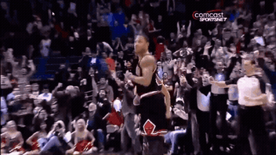 A Basketball Player Stands In Front Of A Crowd With A Comcast Sportsnet Logo GIF