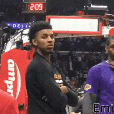 A Basketball Player Stands In Front Of A Scoreboard That Says 2.09 GIF