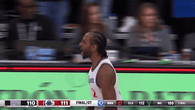 A Basketball Player Stands In Front Of A Scoreboard That Says Final / Ot GIF