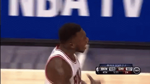 A Basketball Player Stands In Front Of A Tnt Banner GIF