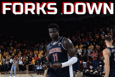 A Basketball Player Wearing A Arizona Jersey Stands On The Court GIF