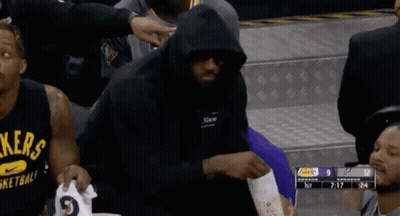 A Basketball Player Wearing A Black Hoodie With The Word Lakers On The Front GIF