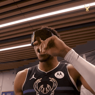 A Basketball Player Wearing A Black Jersey With A Motorola Logo On It GIF
