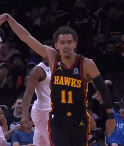 A Basketball Player Wearing A Black Jersey With The Number 11 GIF