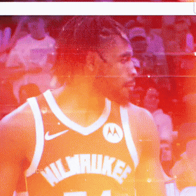 A Basketball Player Wearing A Black Jersey With The Number 34 GIF