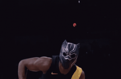 A Basketball Player Wearing A Black Jersey With The Number 4 On It Dunks The Ball GIF
