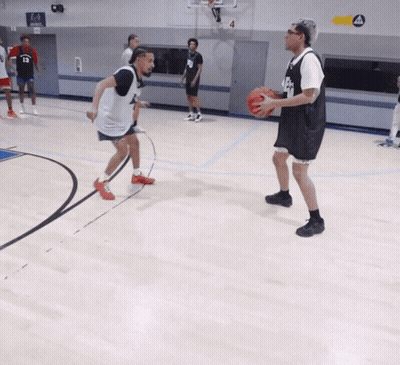 A Basketball Player Wearing A Black Jersey With The Number 8 On It GIF