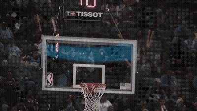 A Basketball Player Wearing A Black Jersey With The Word Chicago On It Is Standing On A Court . GIF