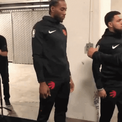 A Basketball Player Wearing A Black Nike Jacket With The Nba Logo On The Sleeve GIF