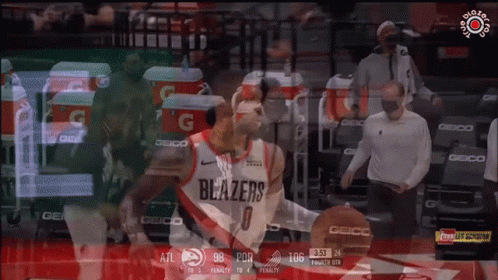 A Basketball Player Wearing A Blazers Jersey Dribbles A Basketball GIF