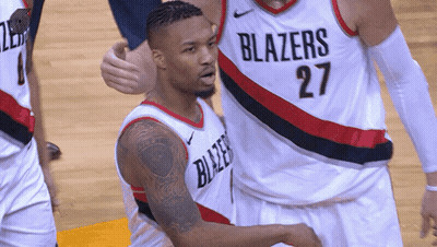 A Basketball Player Wearing A Blazers Jersey Number 27 GIF