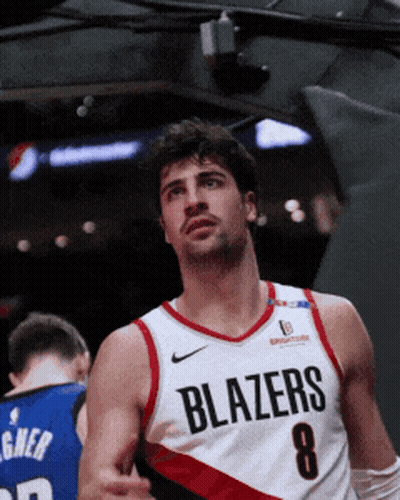 A Basketball Player Wearing A Blazers Jersey With The Number 8 On It GIF