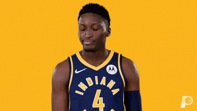 A Basketball Player Wearing A Blue And Yellow Indiana Jersey GIF