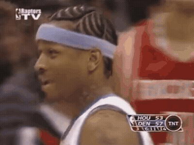 A Basketball Player Wearing A Blue Headband Looks At The Camera During A Game . GIF