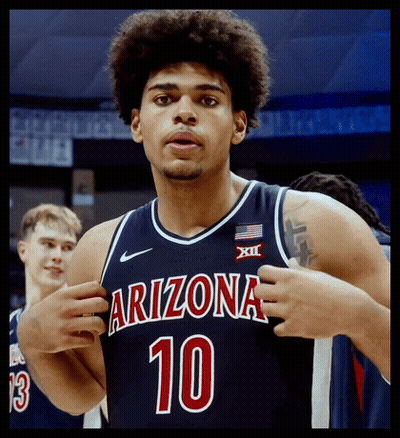 A Basketball Player Wearing A Blue Jersey With The Number 10 On It GIF