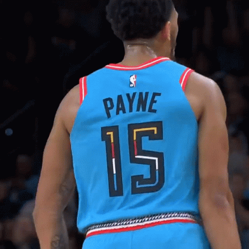 A Basketball Player Wearing A Blue Jersey With The Number 15 On It GIF
