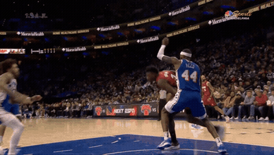 A Basketball Player Wearing A Blue Jersey With The Number 44 On The Back GIF