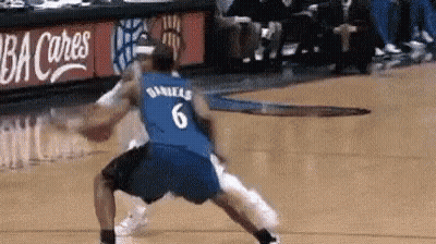A Basketball Player Wearing A Blue Jersey With The Number 6 On It Is Dribbling The Ball . GIF