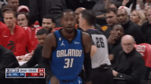 A Basketball Player Wearing A Blue Orlando Jersey GIF